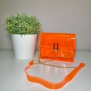 Neon orange transparent bag.